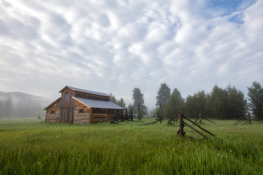 Fog rolls through the Kawuneeche Valley and surrounds this old rustic barn in Rocky Mountain National Park. - Colorado Photography