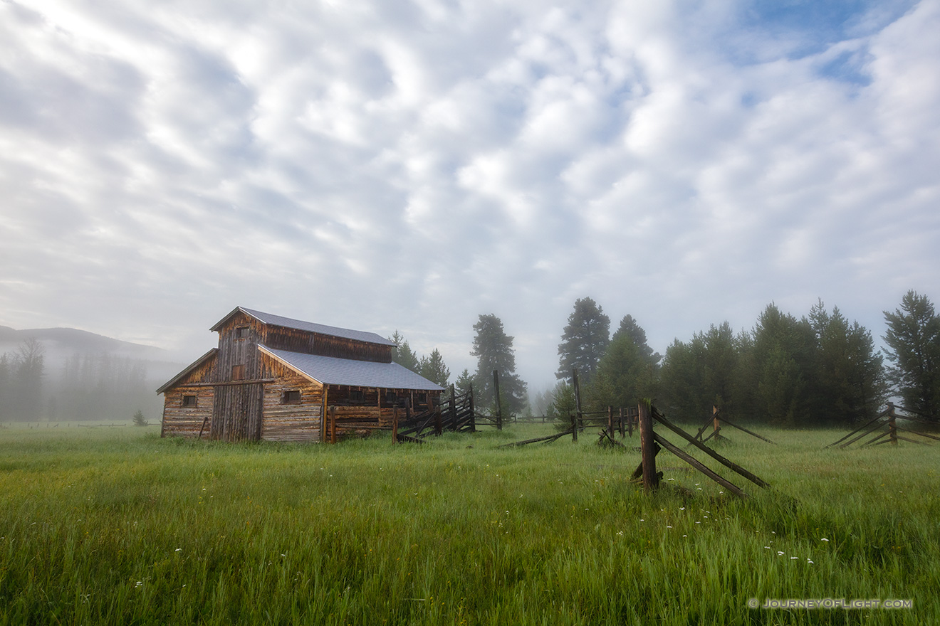Fog rolls through the Kawuneeche Valley and surrounds this old rustic barn in Rocky Mountain National Park. - Colorado Picture