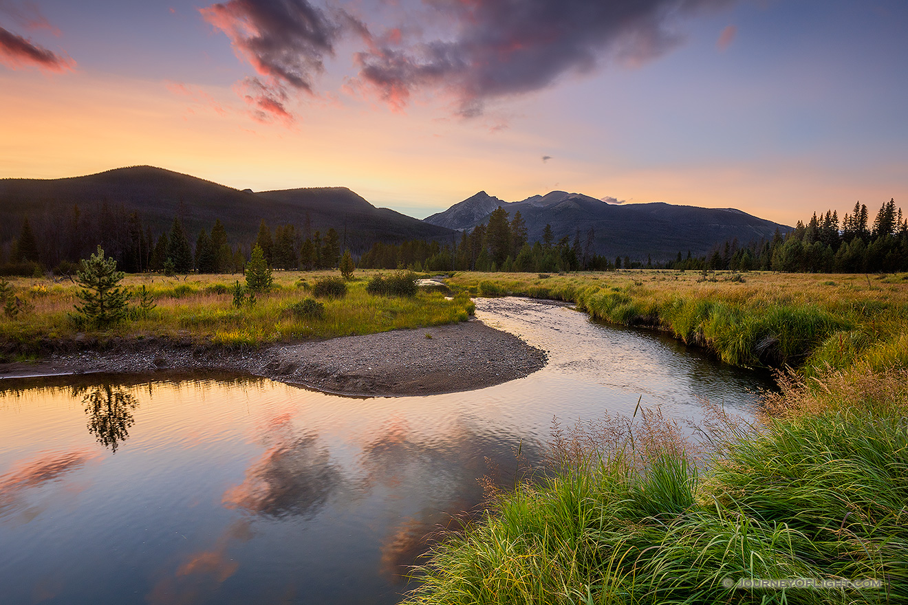 The sun sets behind the Never Summer Range as the Kawunechee River flows through the west side of Rocky Mountain National Park in Colorado. - Colorado Photography