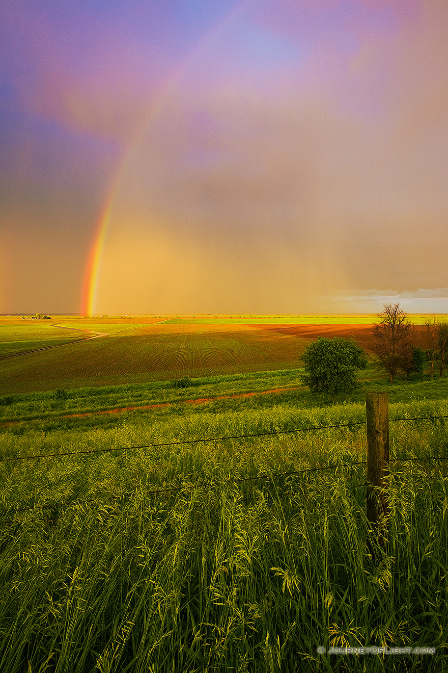 After a rain storm a stunning rainbow touches the ground on the Missouri Valley plains. - Nebraska Picture