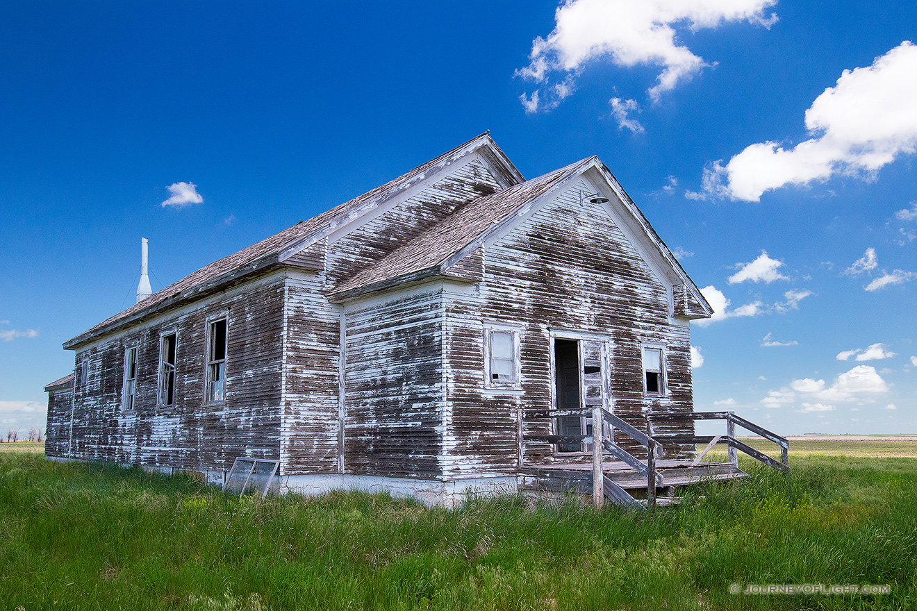 An old abandoned one room schoolhouse sits on the side of the highway near Hemingford, Nebraska. - Nebraska Picture