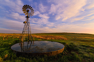 A beautiful sunrise and windmill in the sandhills of western Nebraska. - Nebraska Nature Photograph