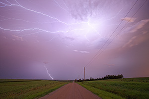 An intense lightning storm in rural eastern Nebraska lights up the sky with bolts extending in all directions. - Nebraska Photograph
