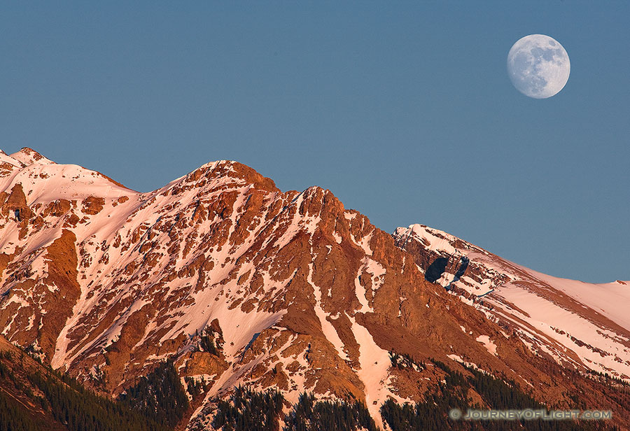 The moon rises over the peaks on the Kootenay Plains in Western Alberta. - Canada Photography