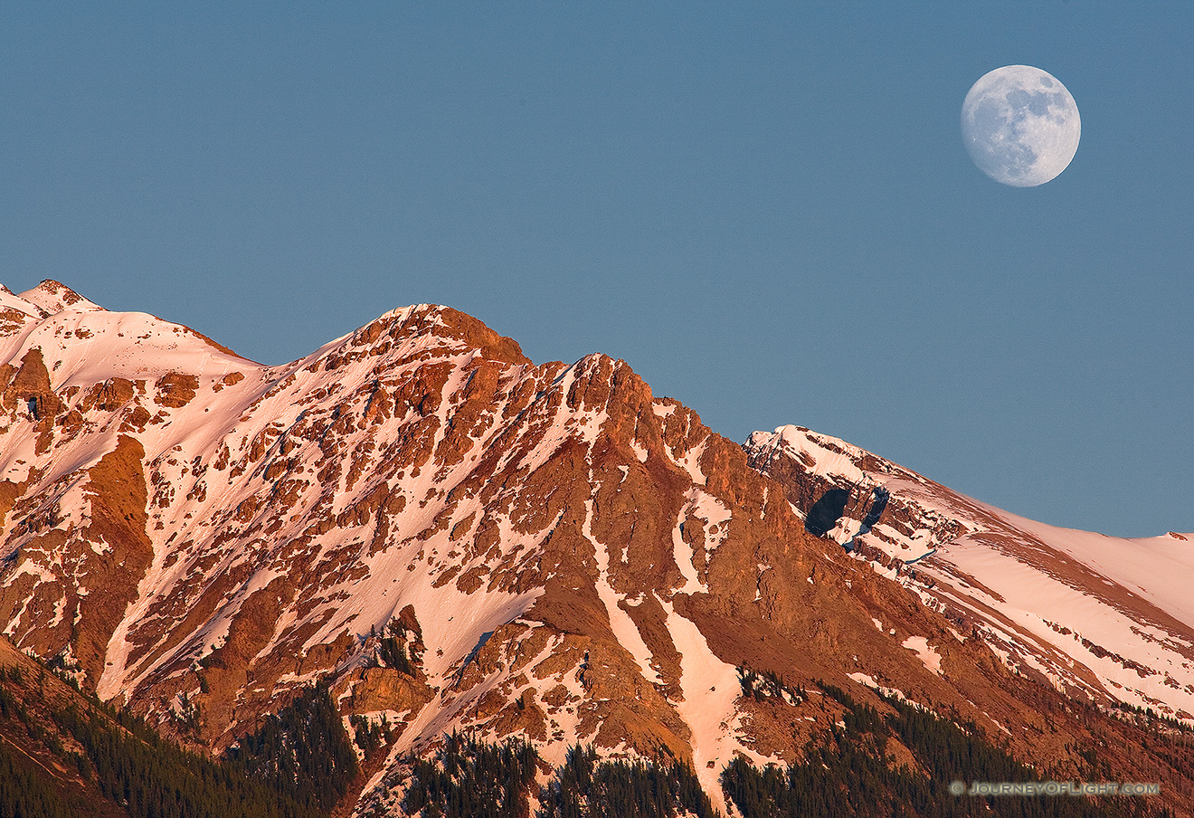 The moon rises over the peaks on the Kootenay Plains in Western Alberta. - Canada Picture